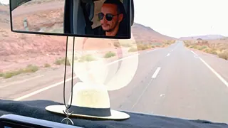 Road perspective from inside a vehicle while planning a Morocco journey