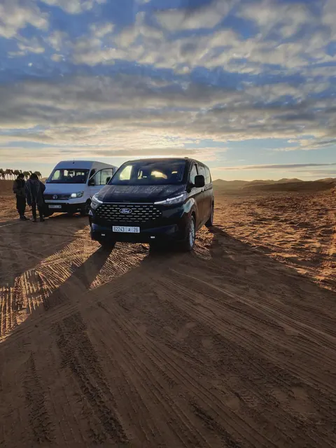 Private vehicles at the edge of the Sahara in Morocco