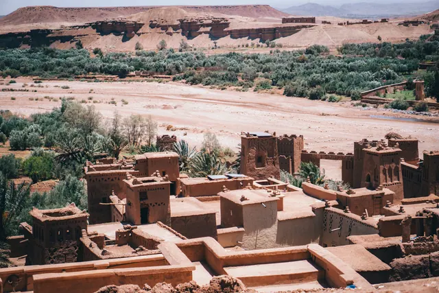 River valley settlement along a private Morocco road journey